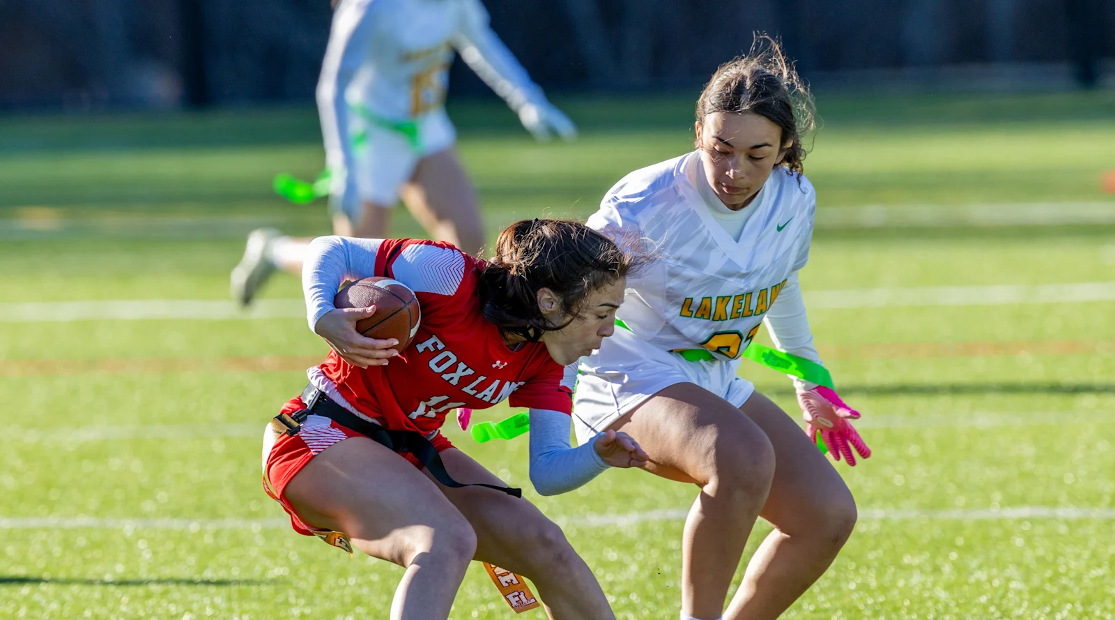 Fox Lane student athlete controls the ball in first flag football game